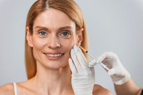 woman getting cheek filler treatment